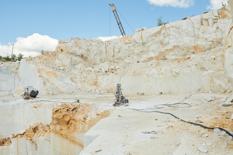 Part of large territory of modern marble quarry with thick white stone walls Mermer Ocagi Makinesi